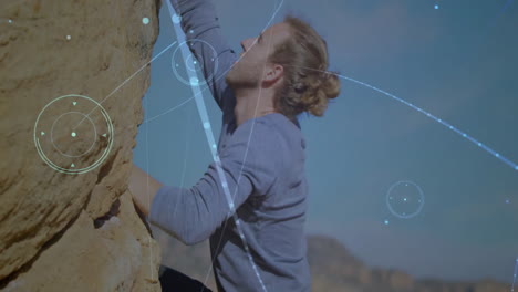 man climbing rock face outdoors, displaying digital overlay charts for technology presentations