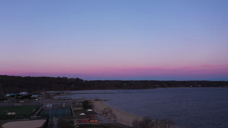 an aerial view over an empty park during a beautiful sunrise