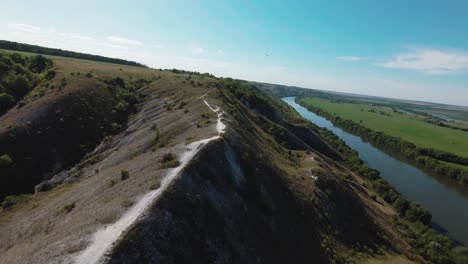 aerial view of a hilly landscape with a river