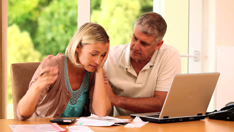 Young-woman-cracking-up-because-of-bills