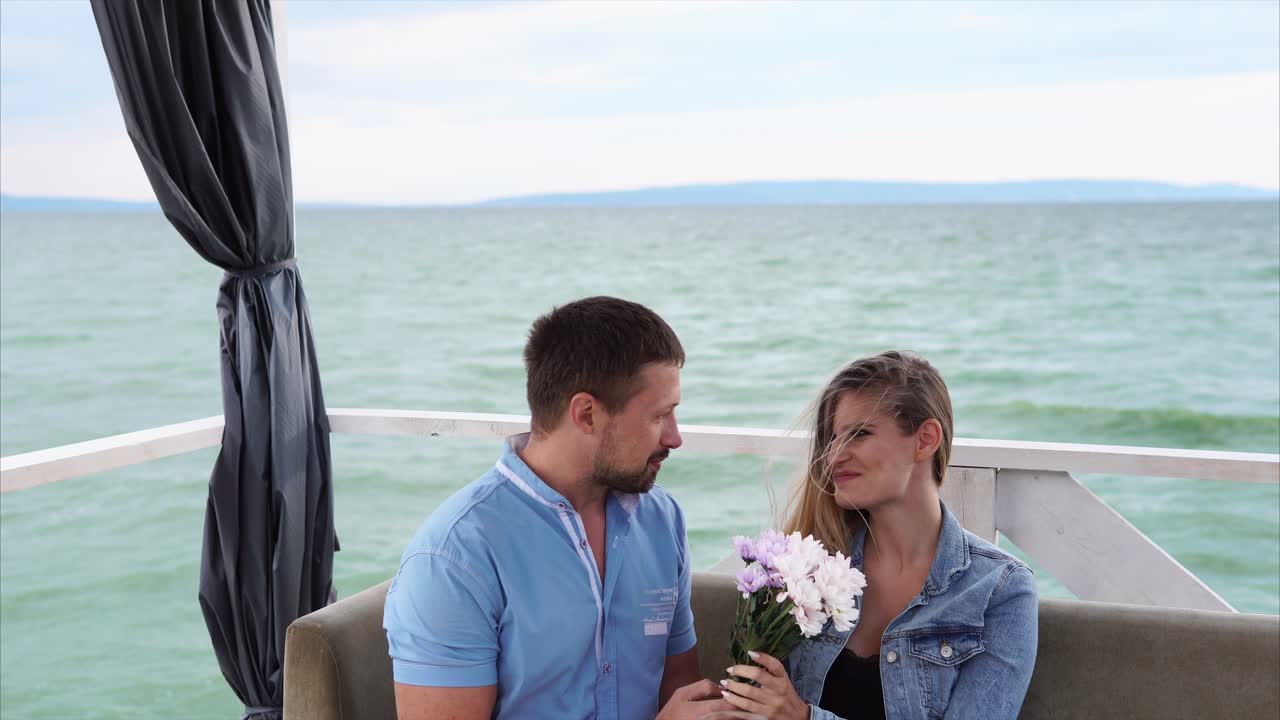 Couple enjoying a romantic dinner by the lake