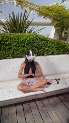 woman meditating with vr headset in a park