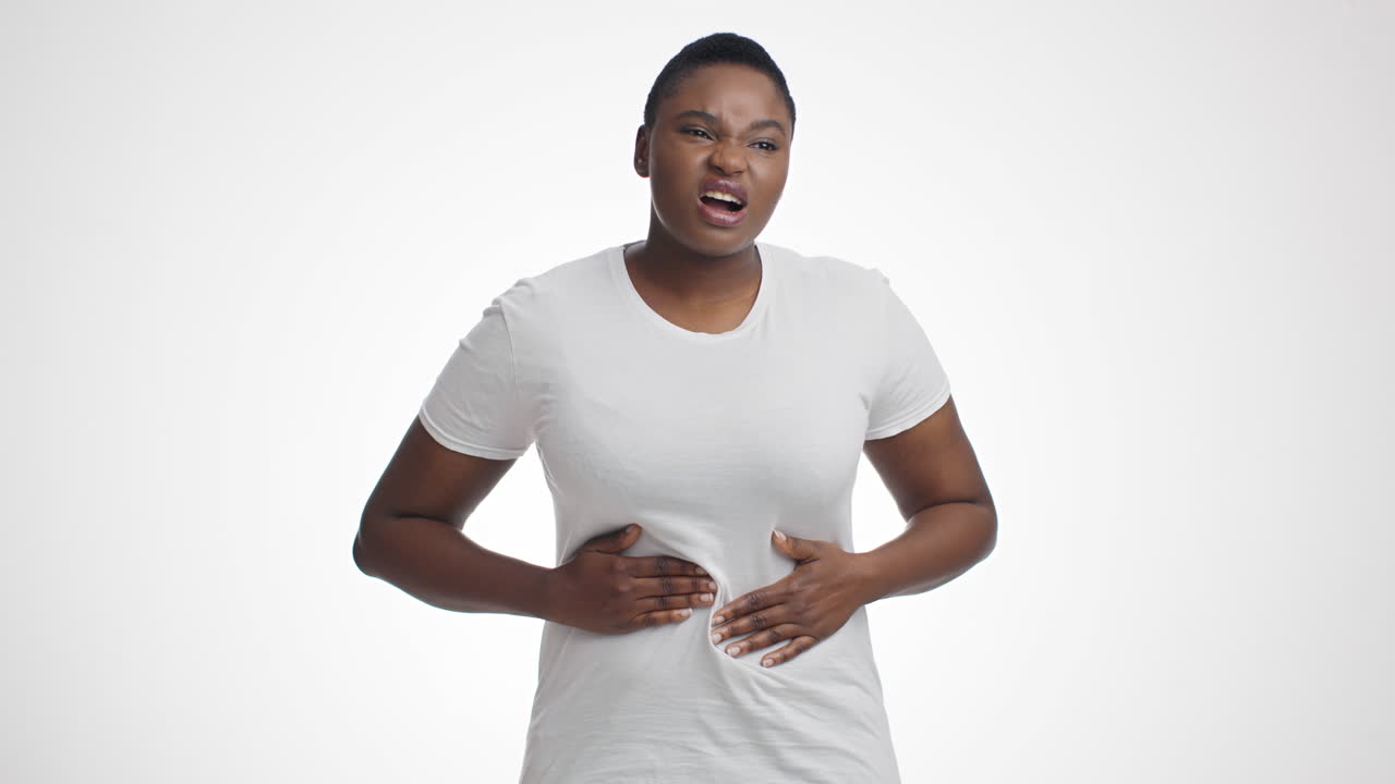 Woman experiencing stomach pain