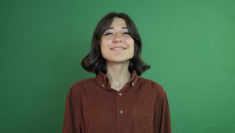 girl blinking on green background