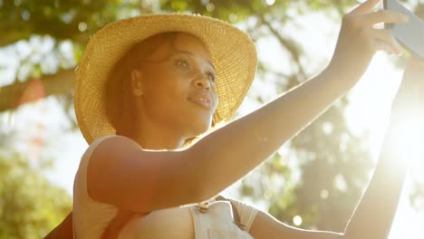 female hiker taking selfie with mobile phone 4k