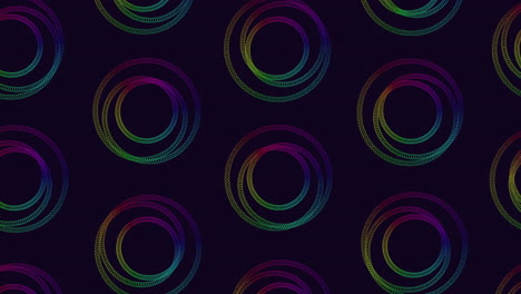 vibrant circles in a spiral arrangement with varied colors like purple, blue, green, yellow, and red form a symmetrical pattern on a black background in this seamless and eye-catching design