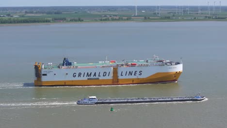 Grimaldi-lines-vessel-in-the-westerschelde-during-day-time,-aerial