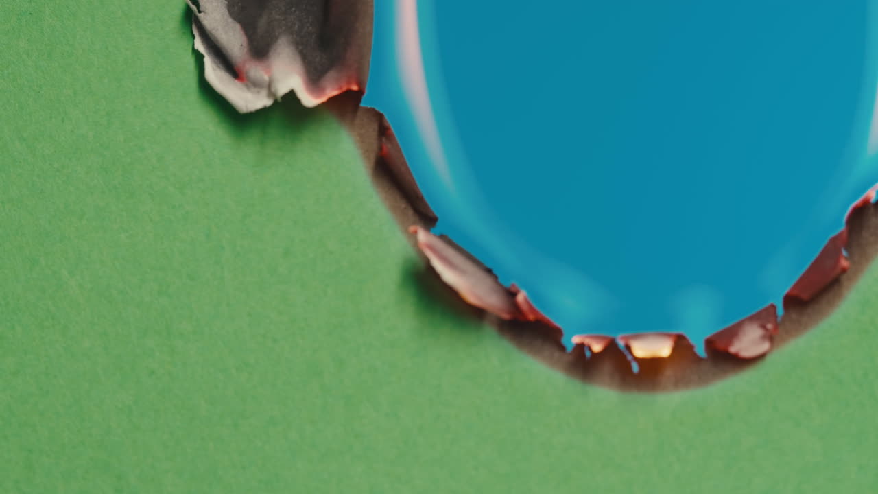 Burned Hole in Green Paper