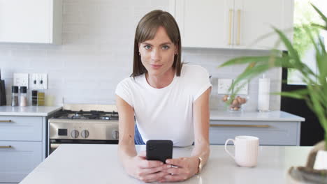 Middle-aged-Caucasian-woman-in-a-modern-kitchen