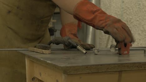 welder setting up mig welding equipment before starting