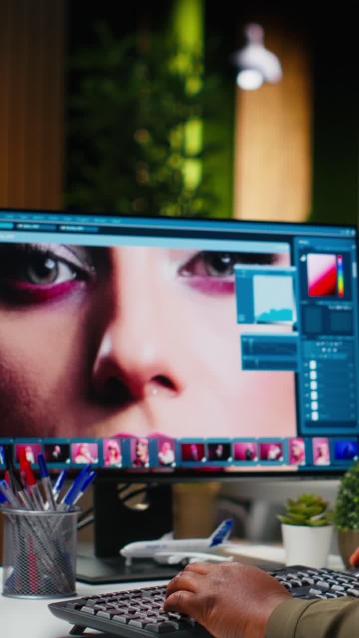 Vertical Video Black photo editor working with retouching software at virtual assistant