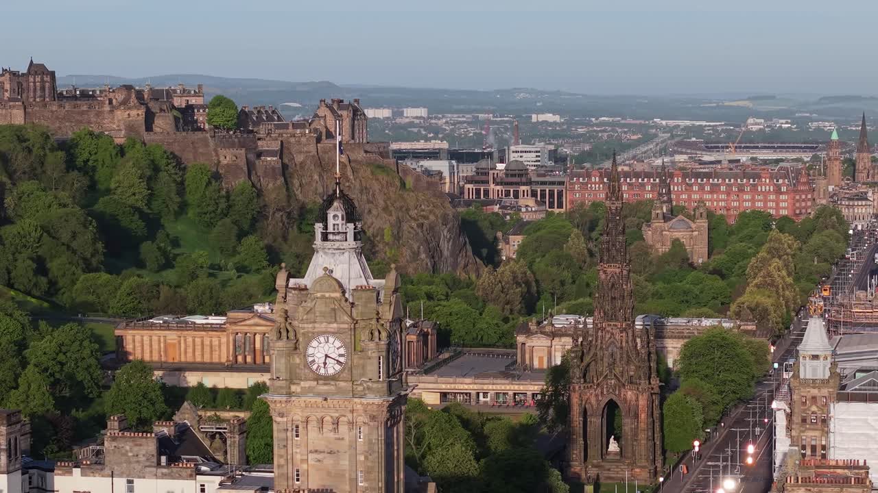 A cinematic drone journey showcasing Edinburgh’s iconic landmarks: the majestic Castle, elegant Balmoral Clock Tower, and the towering Scott Monument