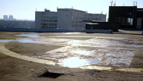 view of the helipad on the roof of a building in the city.