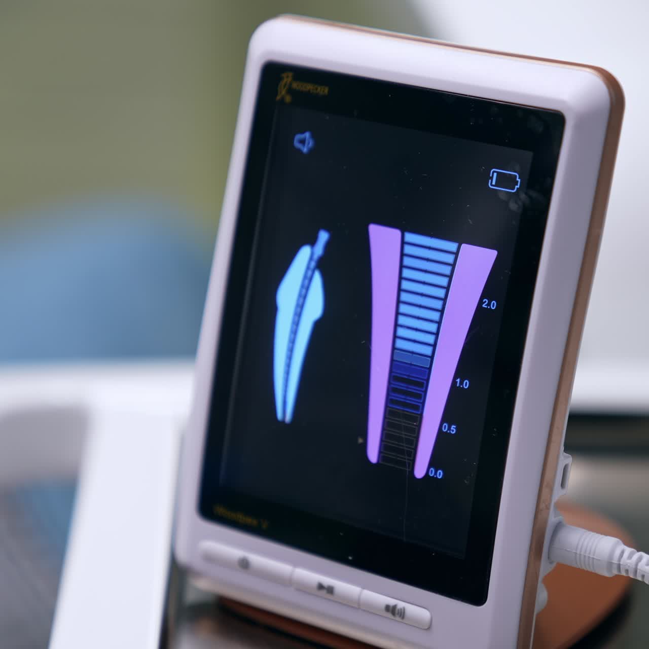 Little screen with some changing parameters. Close up. Advanced equipment for dentistry practice in modern dental clinics. Blurred backdrop