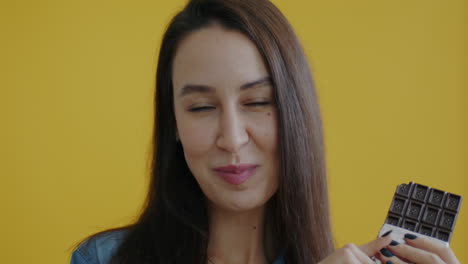 woman enjoying a chocolate bar