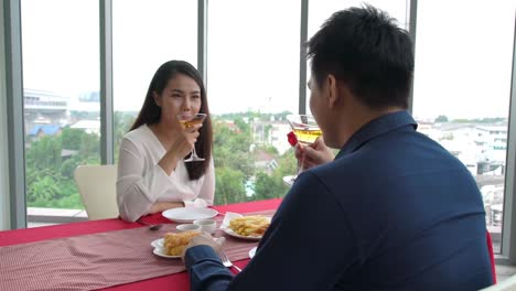 happy romantic couple eating lunch at restaurant