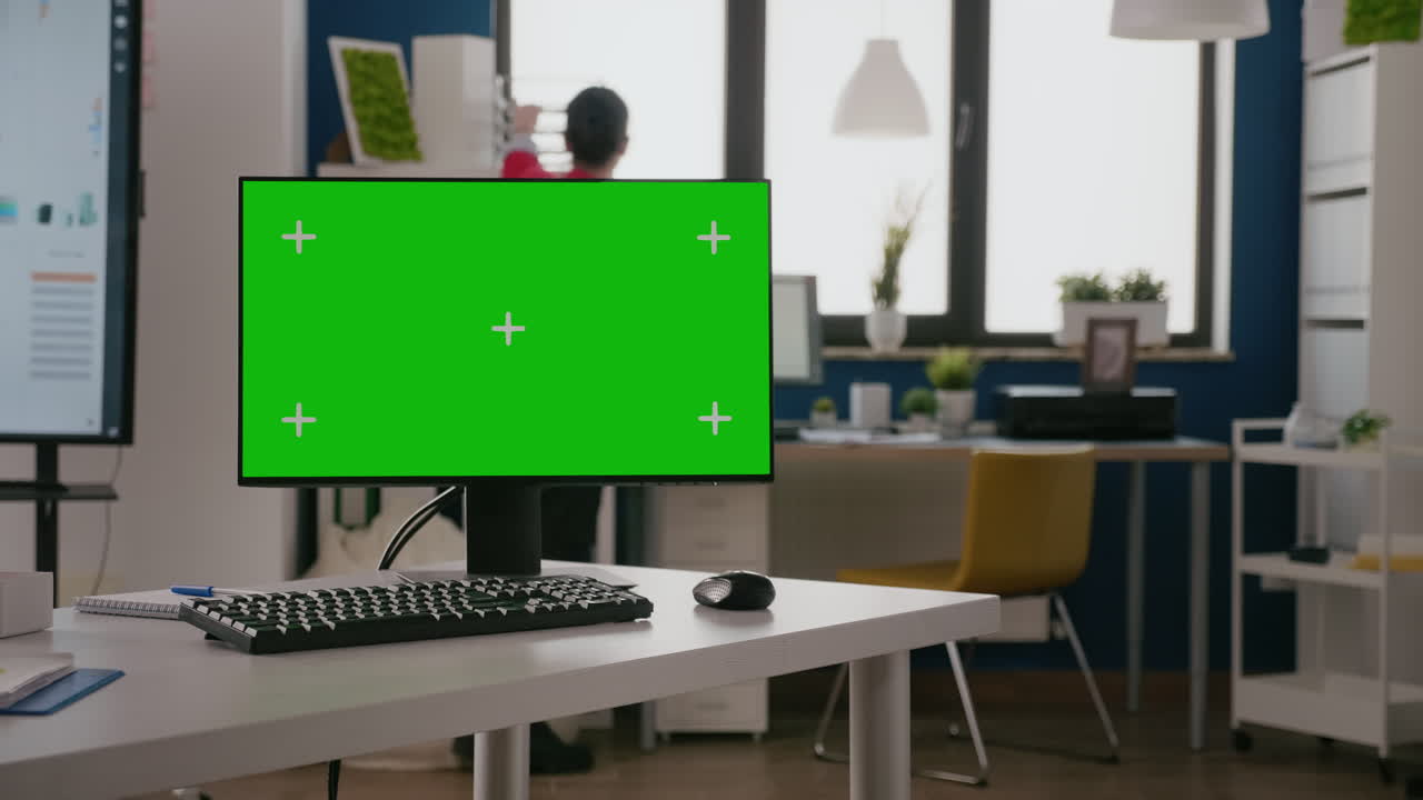 Green screen on computer in business office