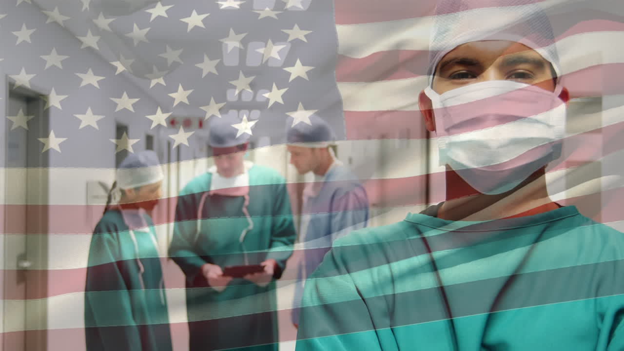 Animation of flag of usa waving over surgeons in operating theatre