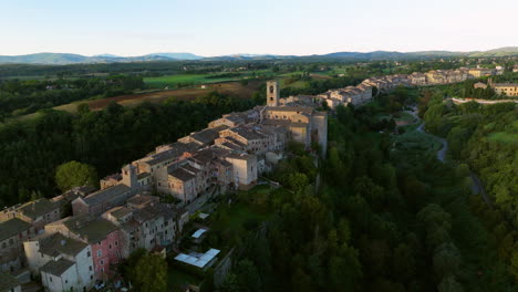 colle di val d'elsa town over senese chianti hills at sunrise in tuscany, italy. aerial drone shot