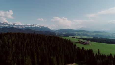 Aerial-of-Lakes,-Forests-and-Mountains-in-rural-Switzerland