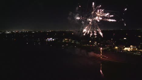 aerial view of fireworks above the lake