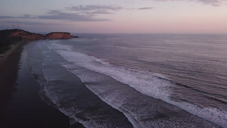 beautiful view of the calm sea during sunset in olon beach in ecuador - aerial shot