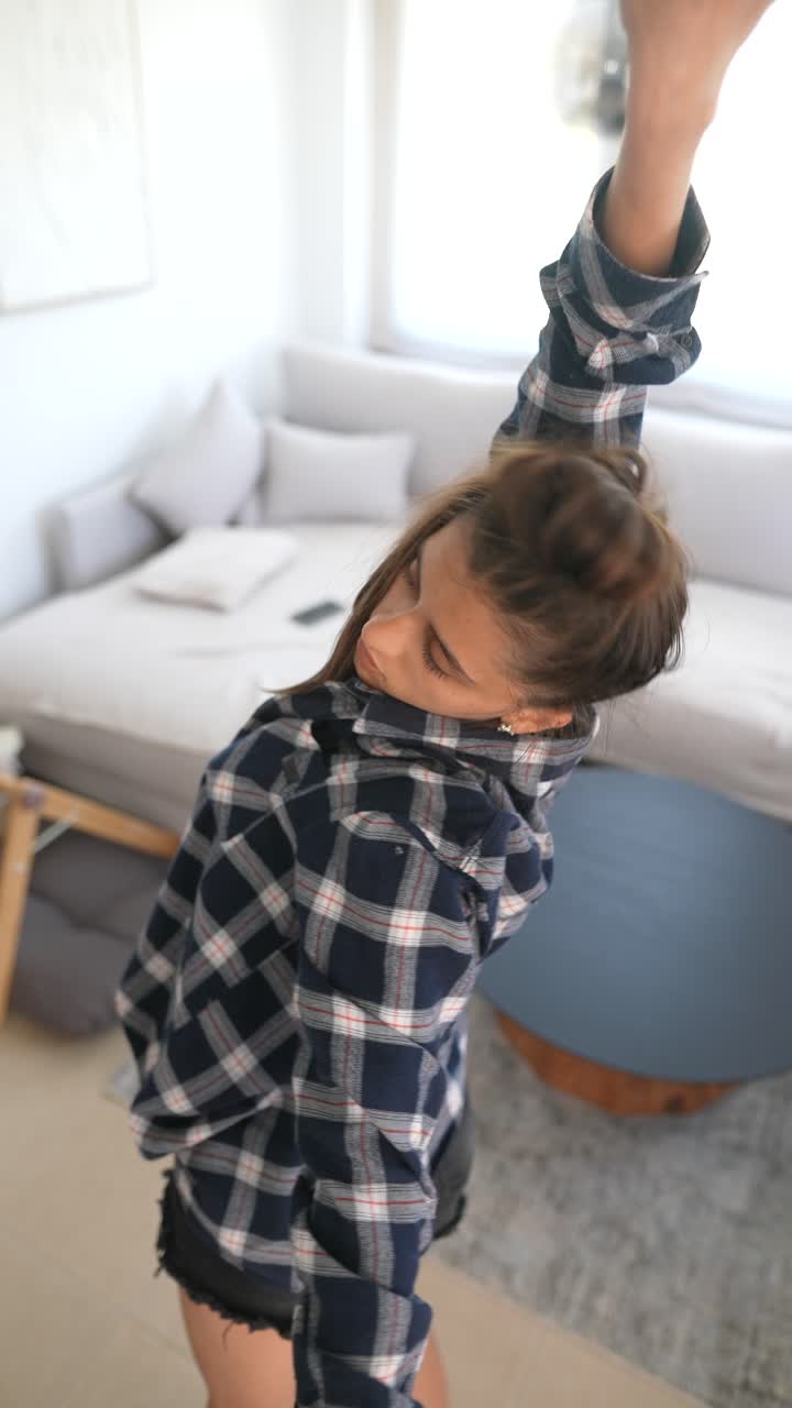 Woman Stretching in Modern Apartment