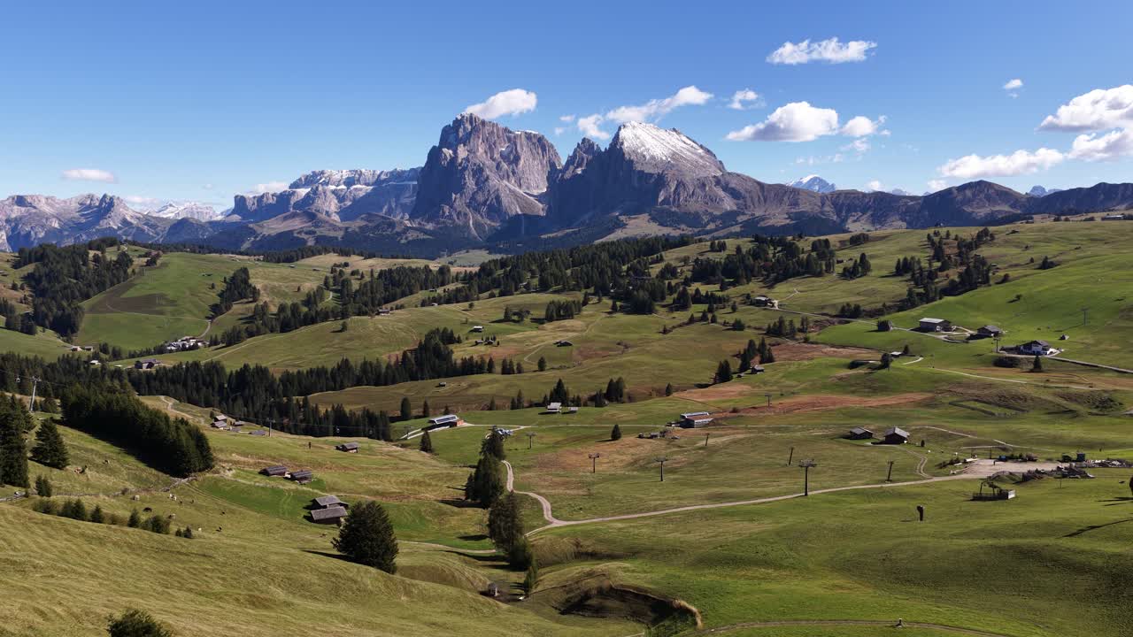 Seiser Alm, Alpe di Siusi largest alpine pasture Alm in Europe near Bolzano in South Tyrol, in northern Italy. Aerial video. Alpine meadows and mountain range views