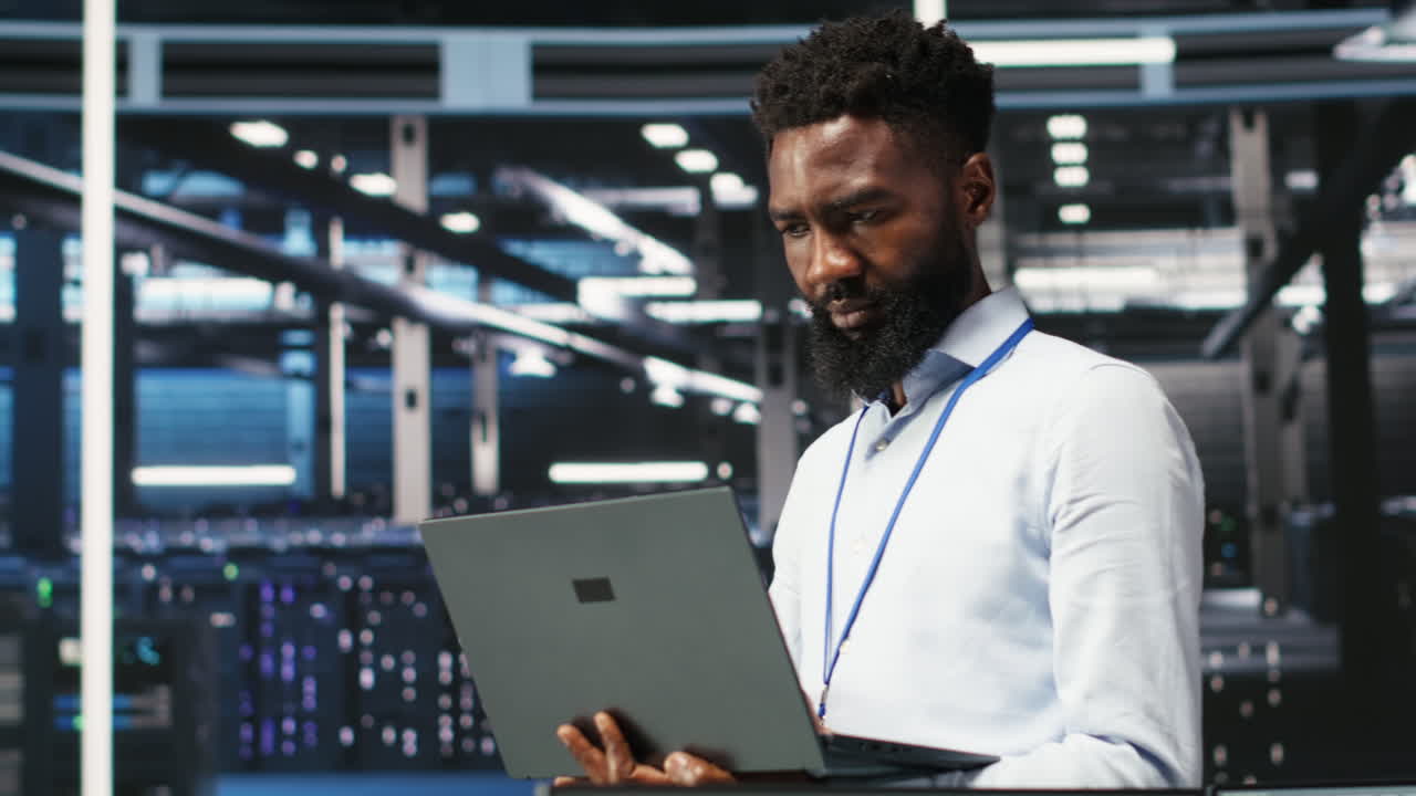 Portrait of data center engineer analyzing gear issues using node tree tool