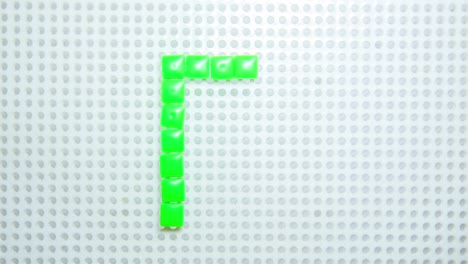 stop motion of the letter r creating one pixel at the time, made with children toys