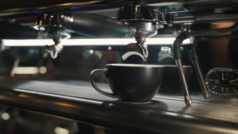 Coffee-machine-on-a-wooden-table-Slow-motion