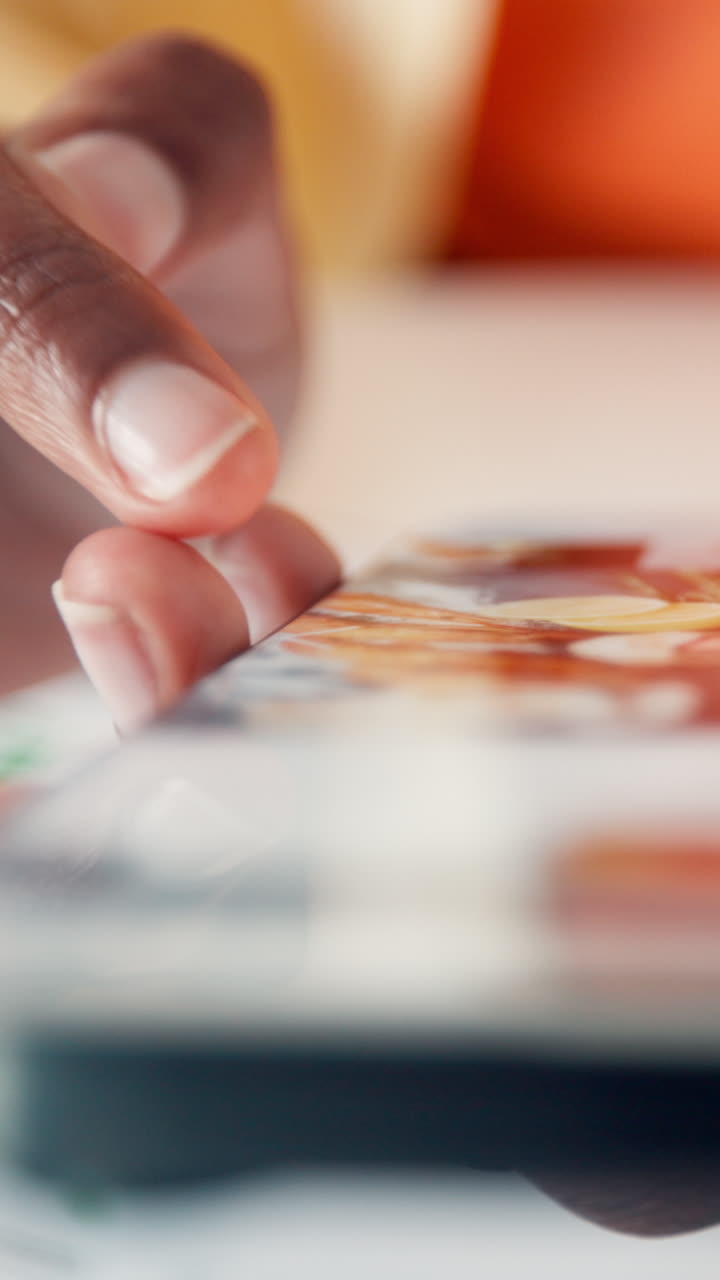 Close Up of Hand Swiping on a Digital Tablet Screen