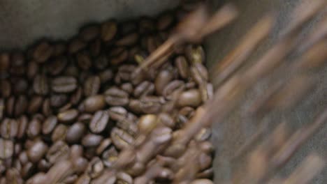 discover the intricate cozy journey of artisanal coffee bean roasting in a warm workshop setting.