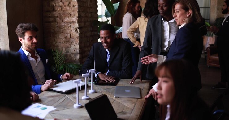 Diverse Business Team Discussing Renewable Energy Project in Office