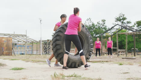 female friends enjoying exercising at boot camp together