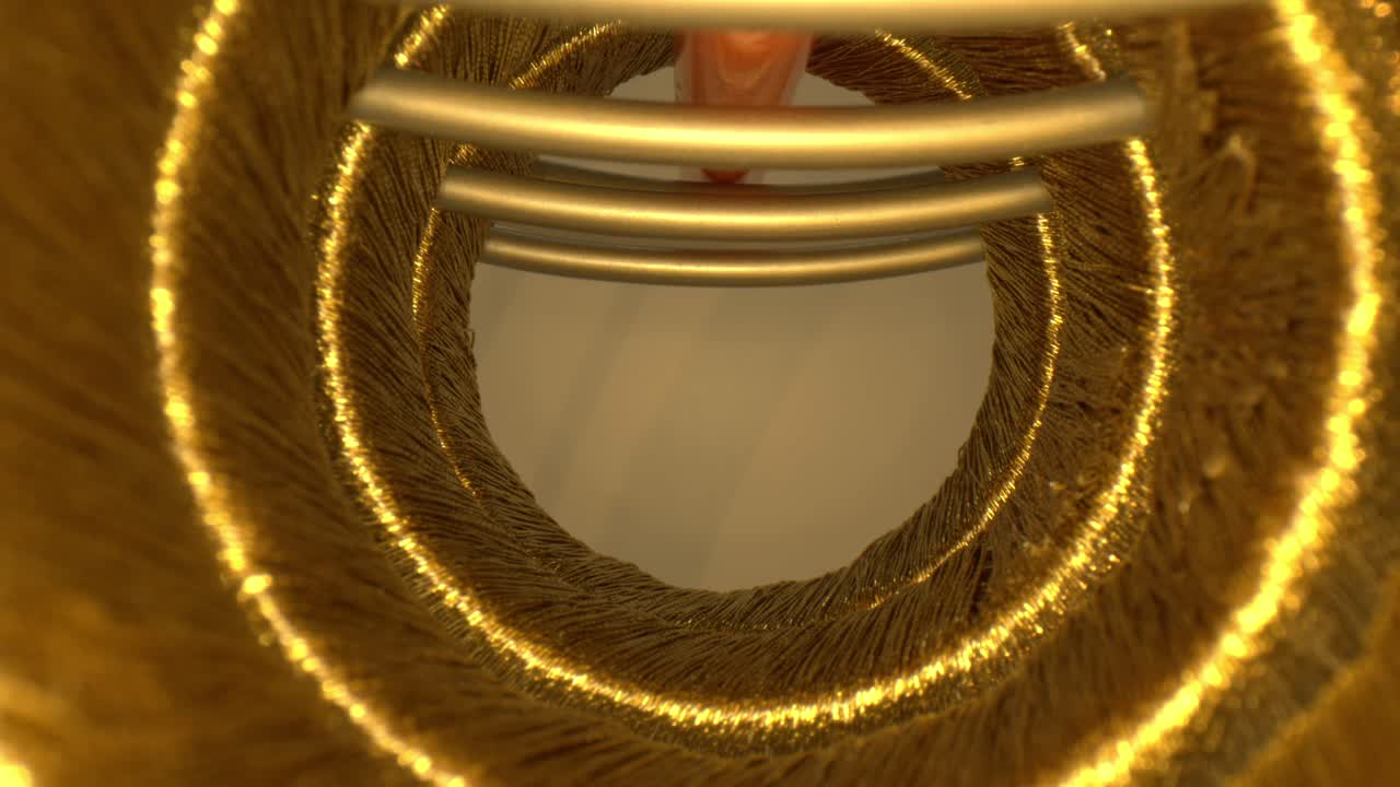 일련의 나사산 금 고리 내부를 빠르게 밀고, 끝에서 잠시 멈춘 다음 시리즈의 끝으로 당깁니다. 여전히 황금 고리의 터널 안에 둘러싸여 있습니다.