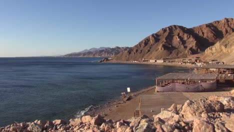 rugged desert red sea coastline at famous blue hole from rocky hilltop