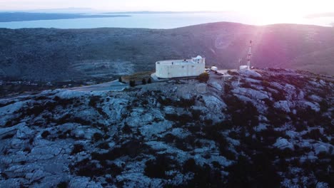 a beautiful view of the sunset and the observatory on the mountain