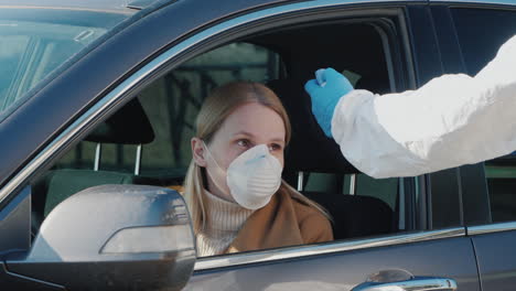 the driver has their body temperature measured - temperature screening in quarantine and control of the coronavirus epidemic