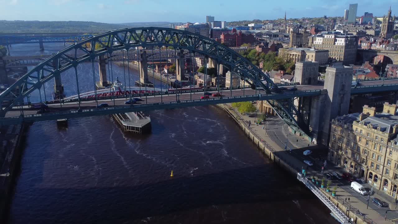 Aerial view over Newcastle Quayside and traffic passing over iconic Tyne Bridge - Newcastle, England