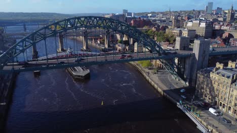 aerial view over newcastle quayside and traffic passing over iconic tyne bridge - newcastle, england