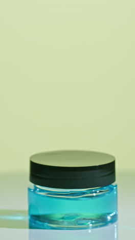 blue cosmetic jar with clear liquid