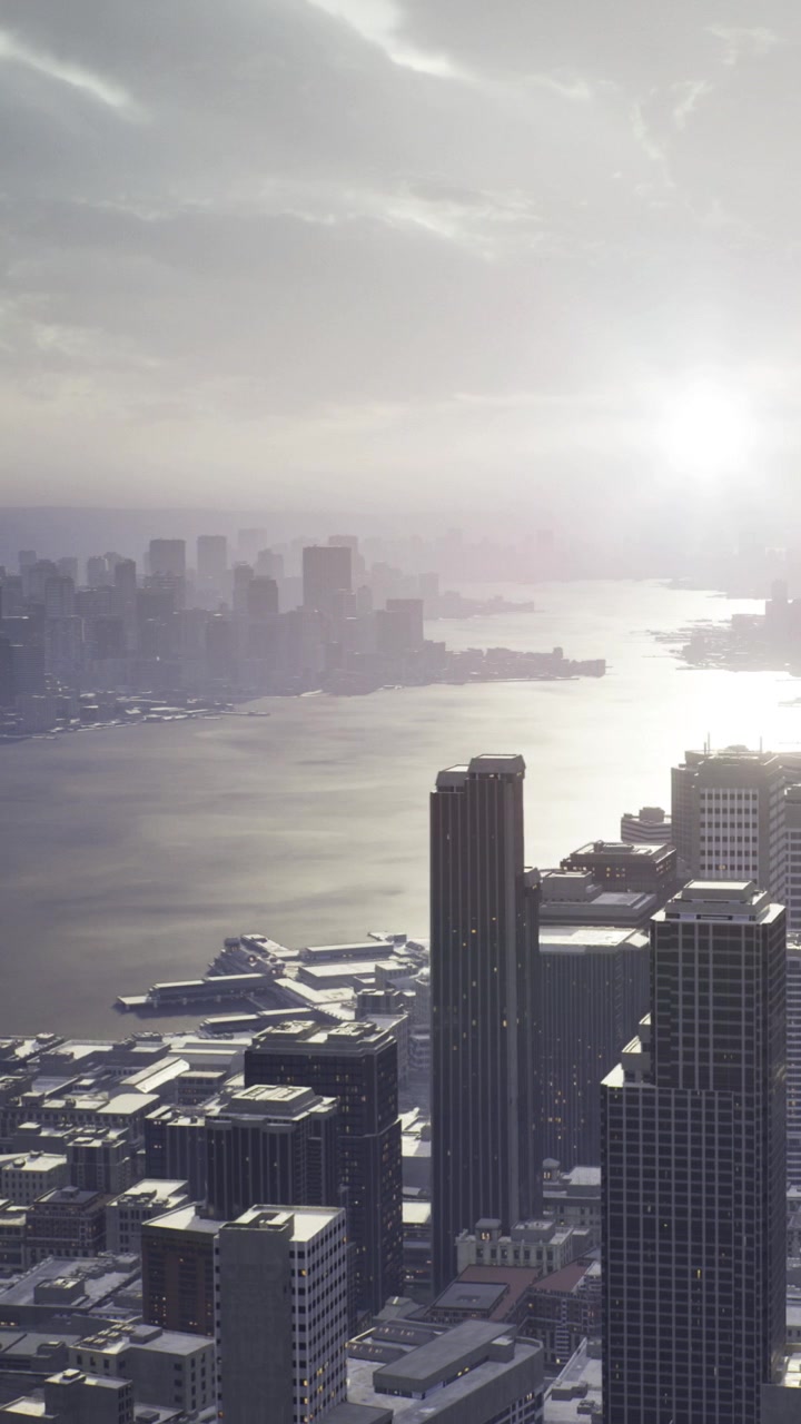 Vista do horizonte da cidade sobre a água com edifícios e luz solar ao fundo.