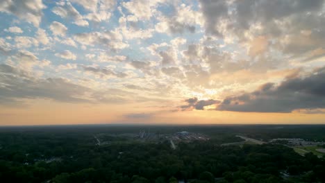 A-stunning-aerial-view-of-a-scenic-sunset-with-clouds-spreading-across-the-sky