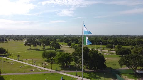 aerial pullback reveal patriotic argentina flag wave brilliant in wind