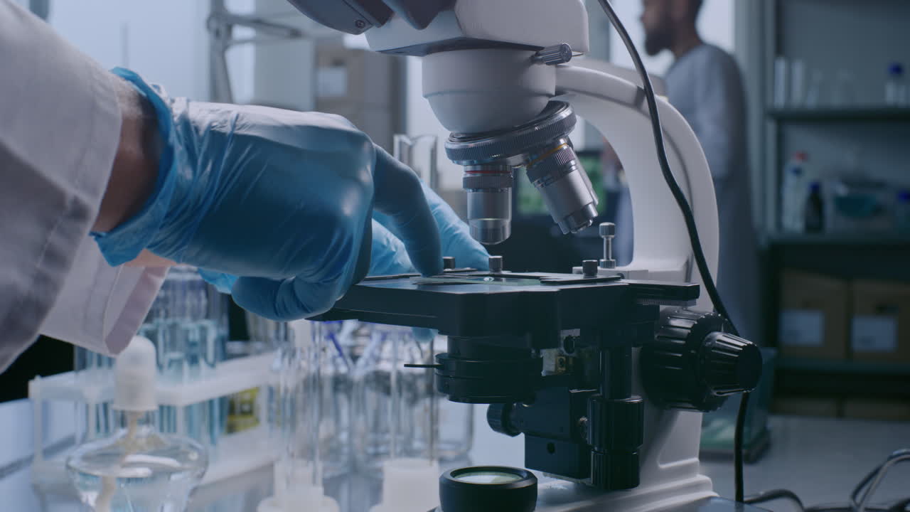 Scientist Using Microscope in Laboratory