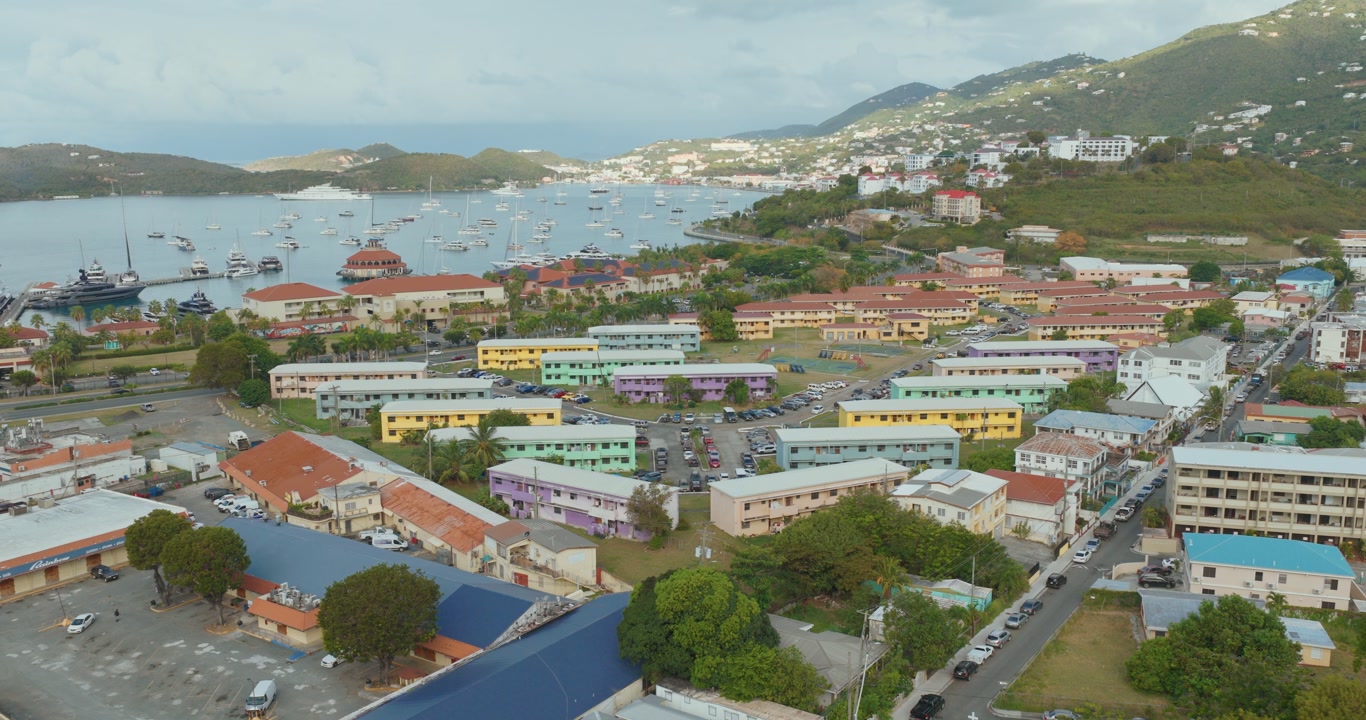Residential And Commercial Buildings In Charlotte Amalie, Capital City Of The U.S. Virgin Islands On St. Thomas, USA. Aerial Pullback Shot