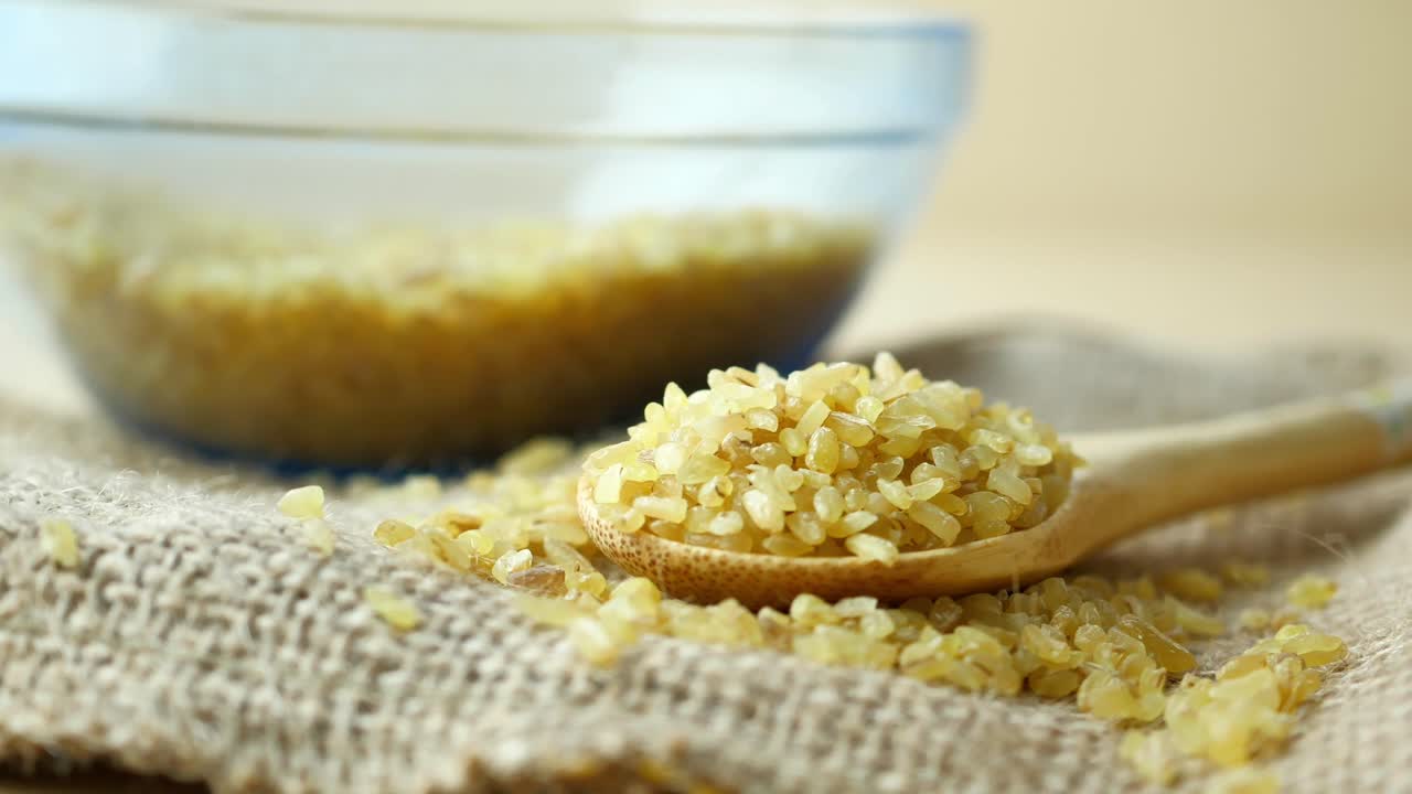Bulgur in Wooden Spoon and Bowl