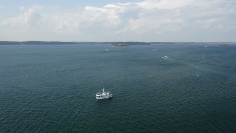 wide aerial shot of a boat on the st lawrence river