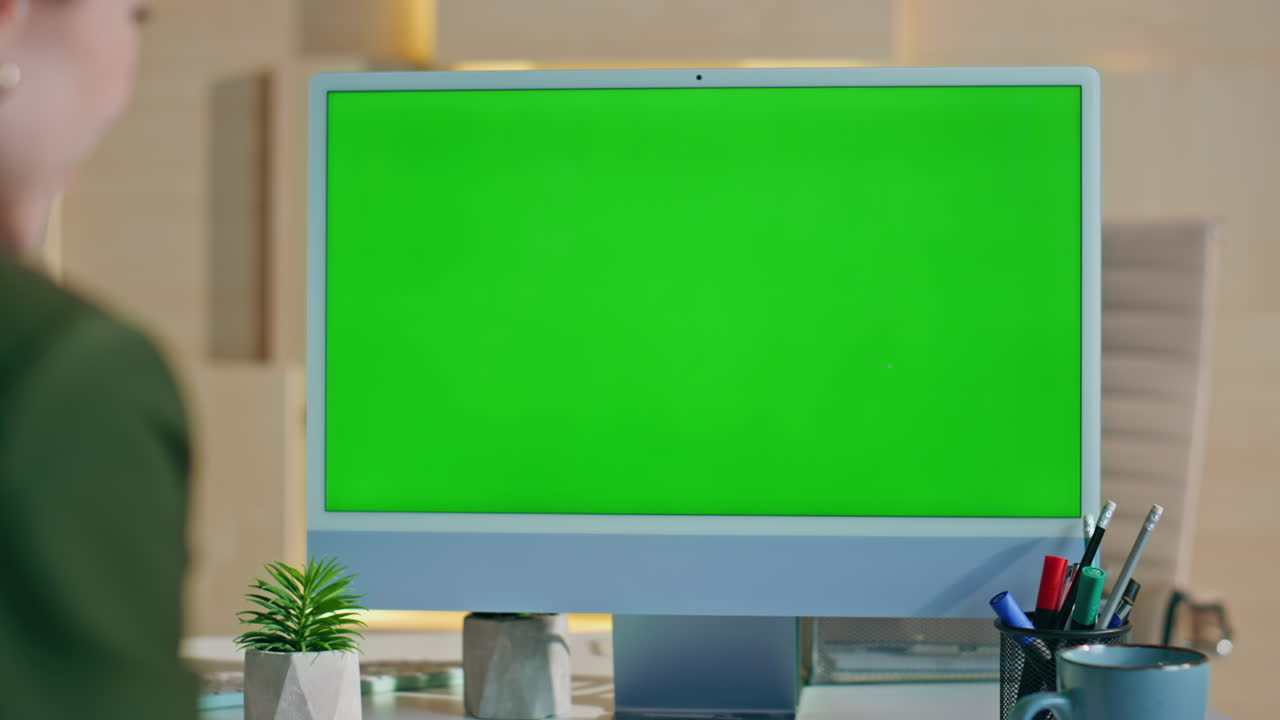 Businesswoman videocalling mockup computer at modern corporate office close up.